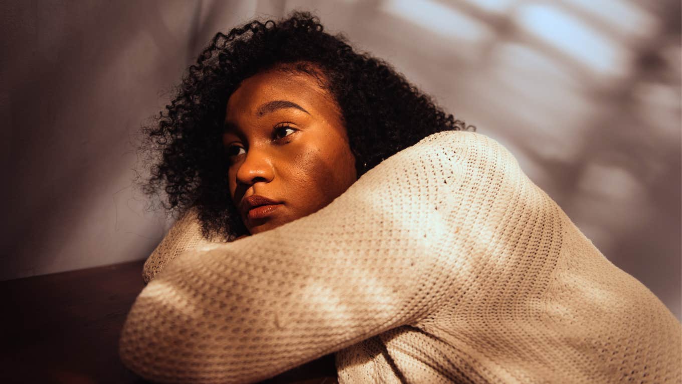 exhausted woman feeling anxious at home alone