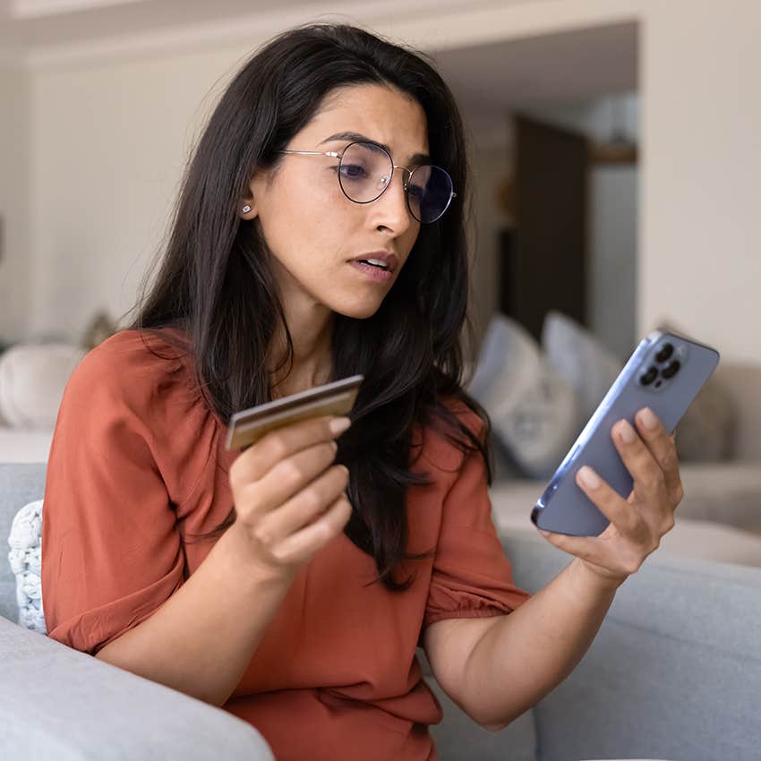 stressed woman paying off credit card balance