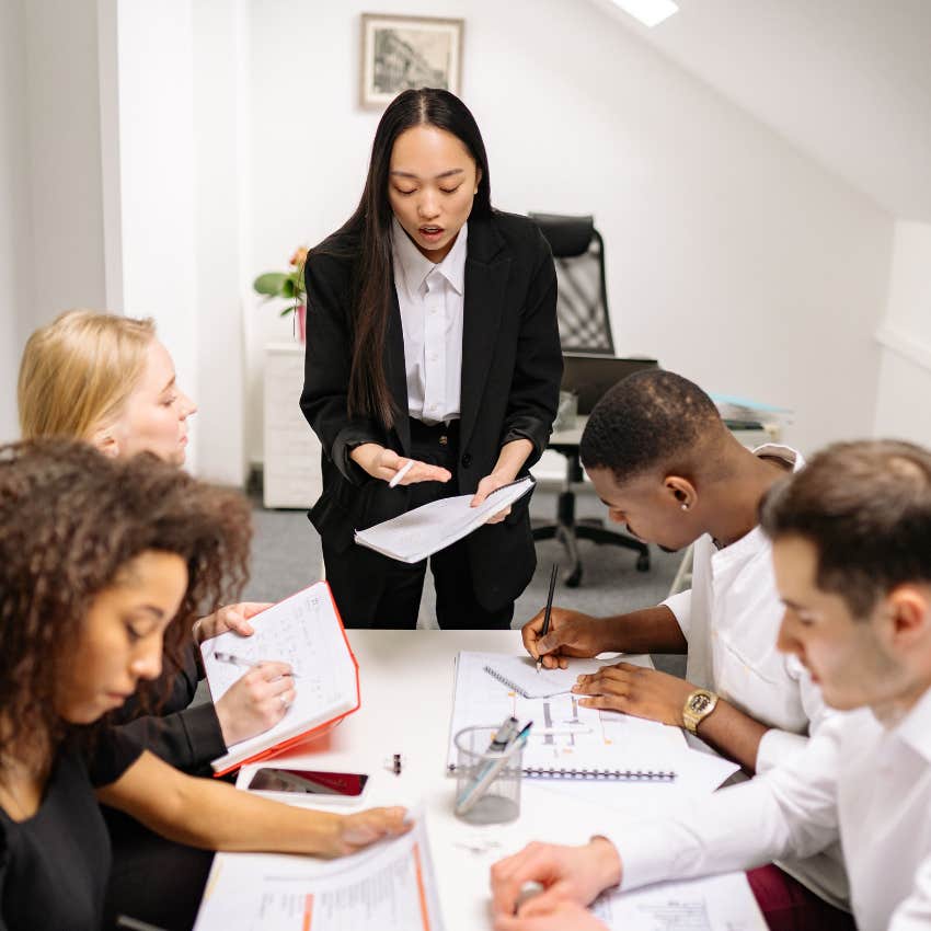 Upset employee confronting others for not sharing responsibility