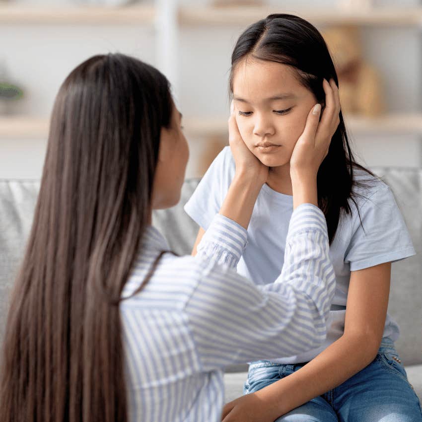 supportive parent comforting her child