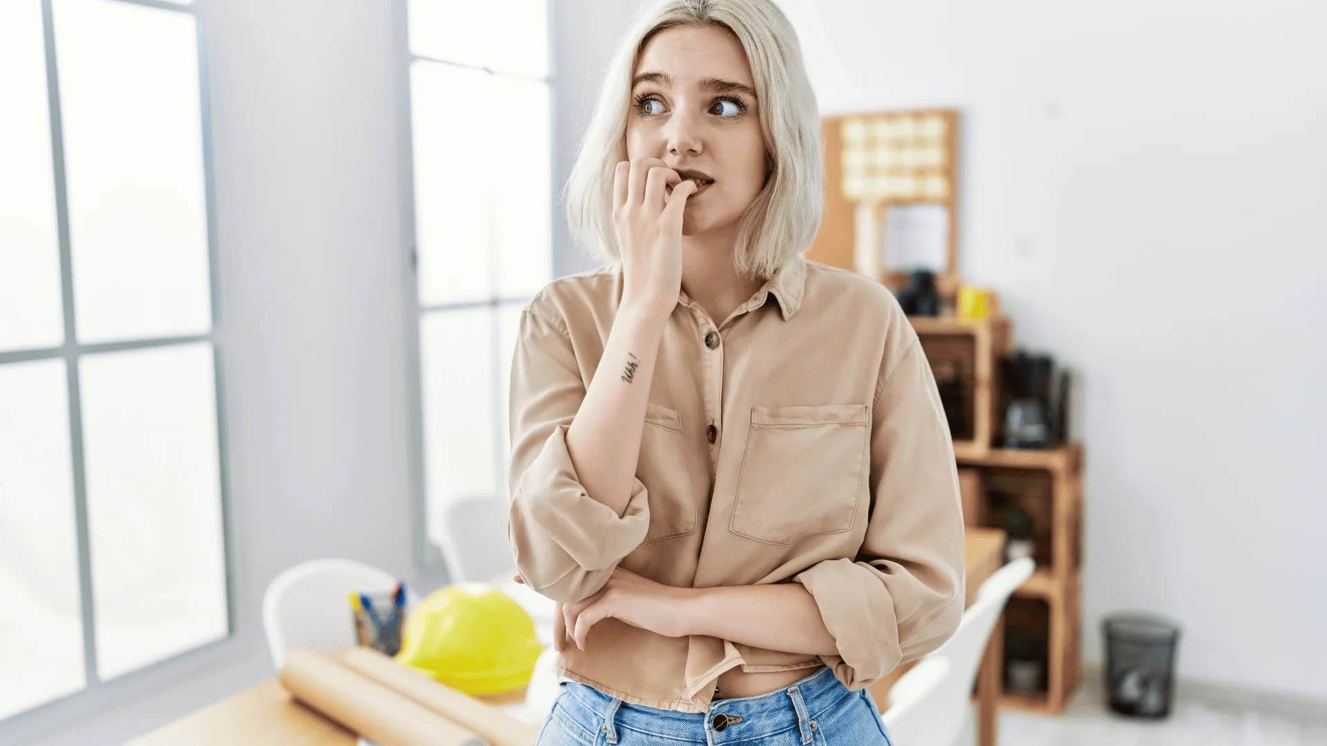 emotionally intelligent gen Z woman in the office thinking