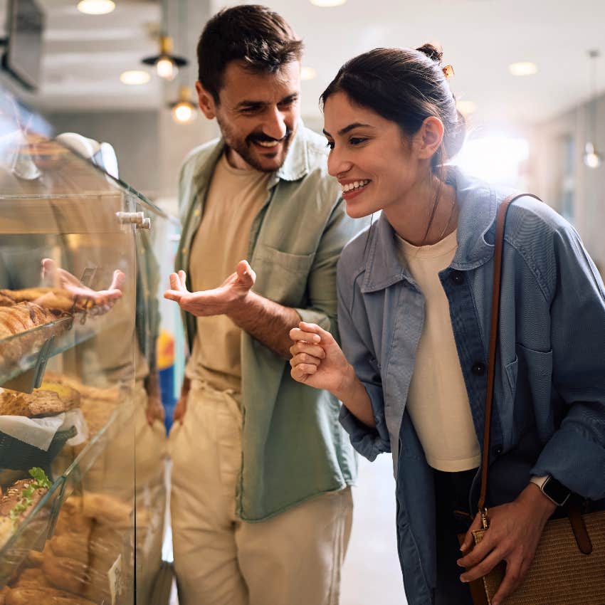 Gen Z couple buying little treats at a bakery