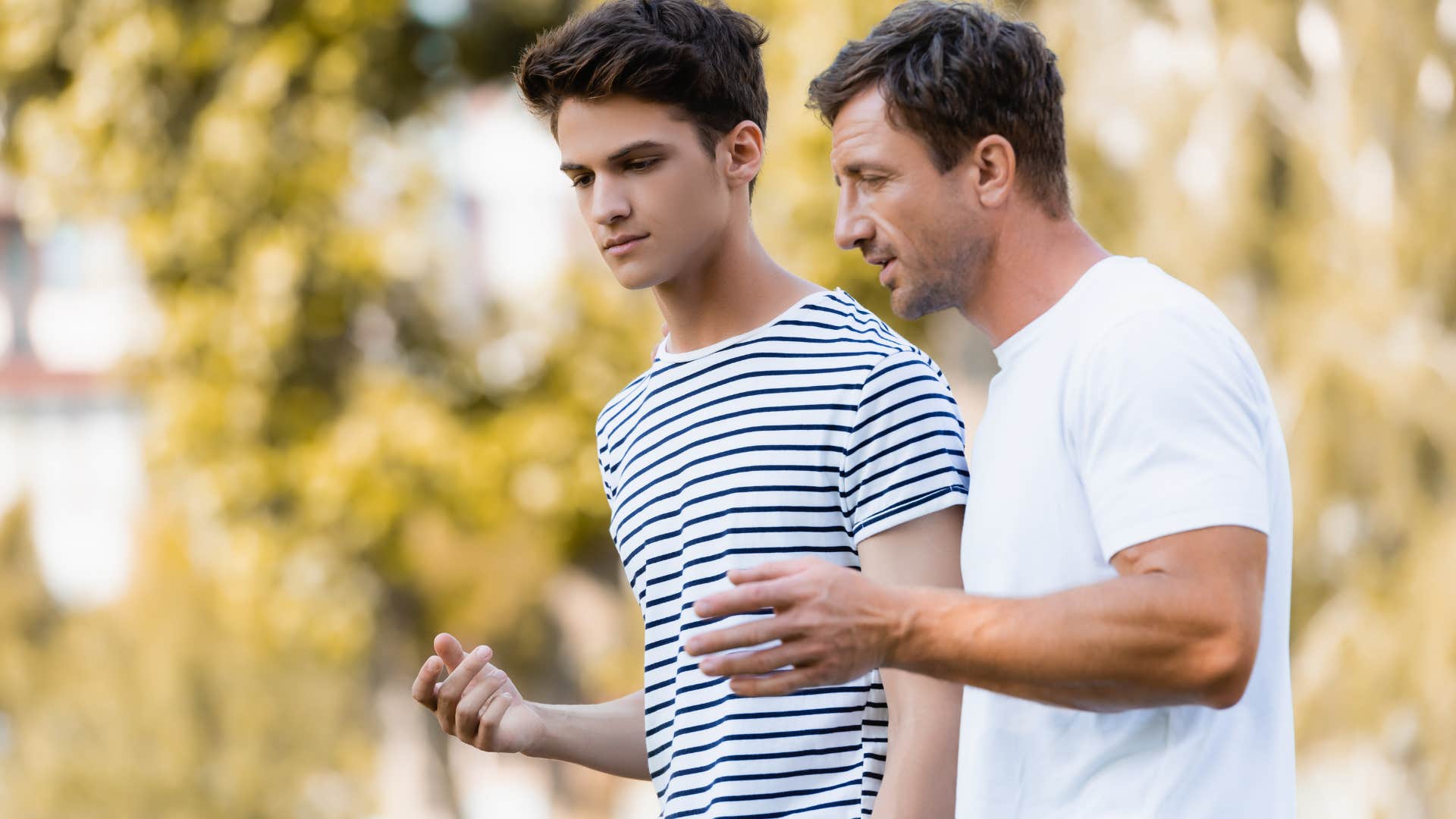 high-quality dad teaching teen son to never fear him