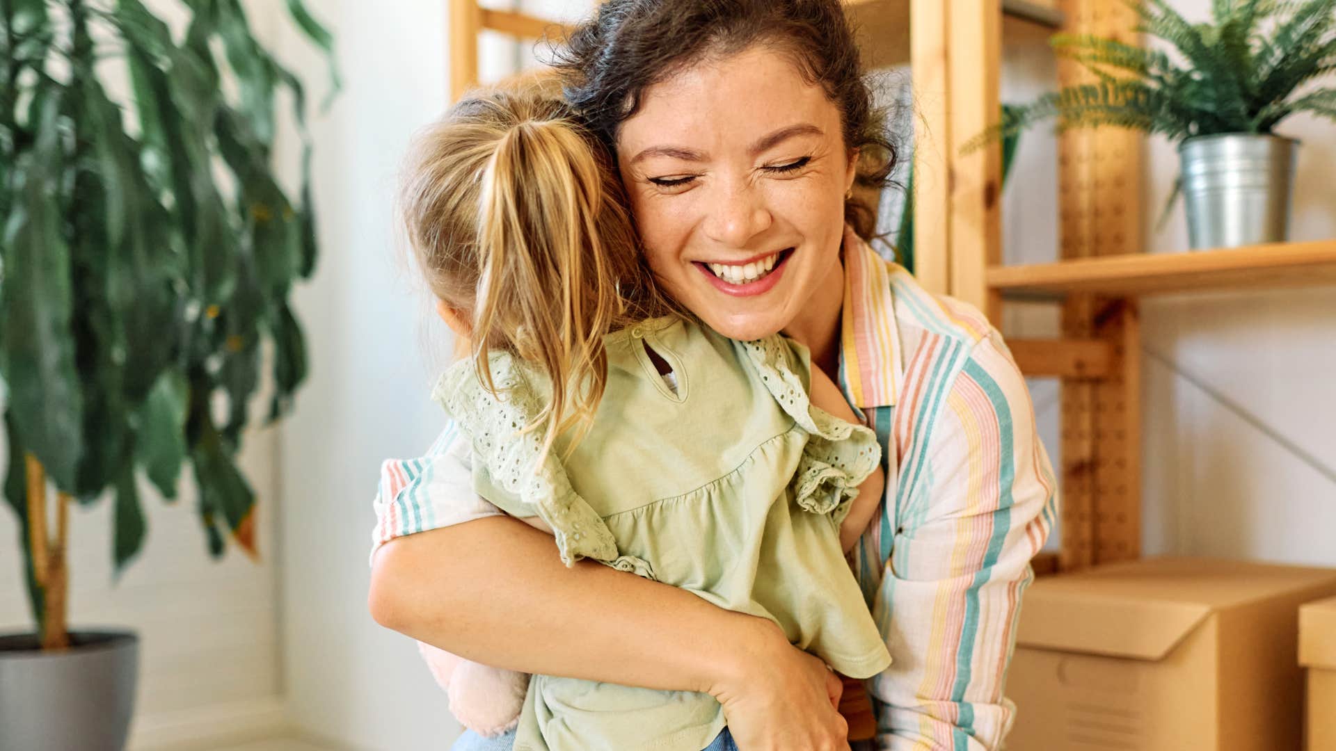 high-quality mom hugging daughter because love is not conditional