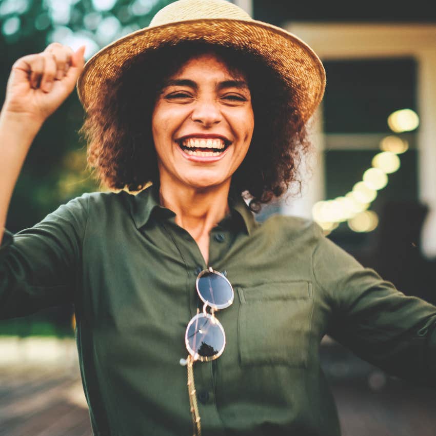 smiling woman born in the summer creating her own fun