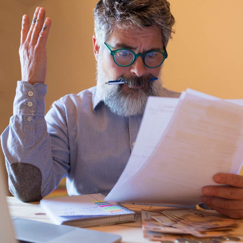 man who feels behind financially looking at budget thinking everyone else has it figured out