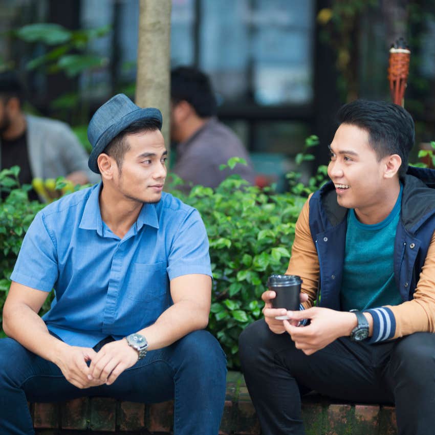 man asking his friend follow-up questions