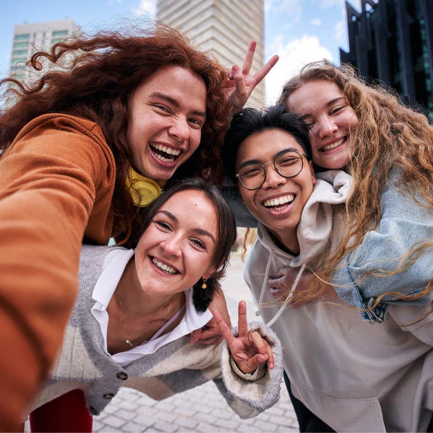 happy group of friends taking a photo together