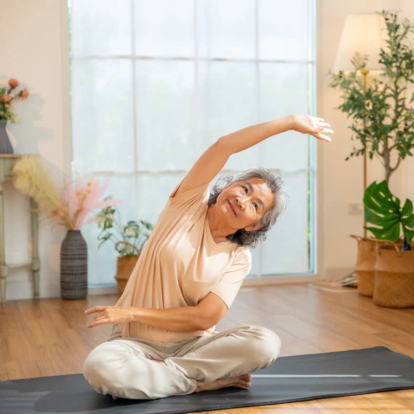 mature woman who is physically and mentally strong doing yoga because she never stops moving