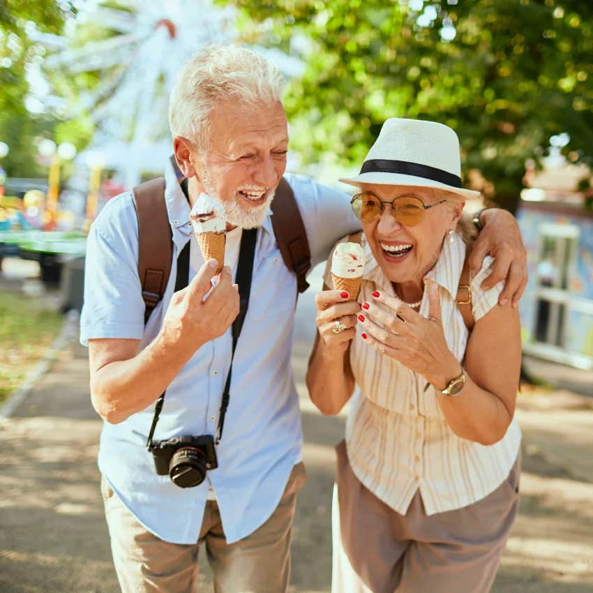 aging couple laughing to stay mentally physically strong