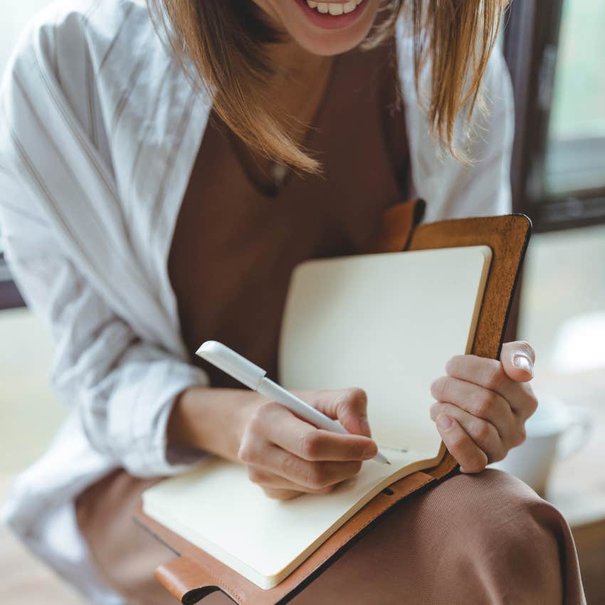 woman with a calm mind who keeps journals at home