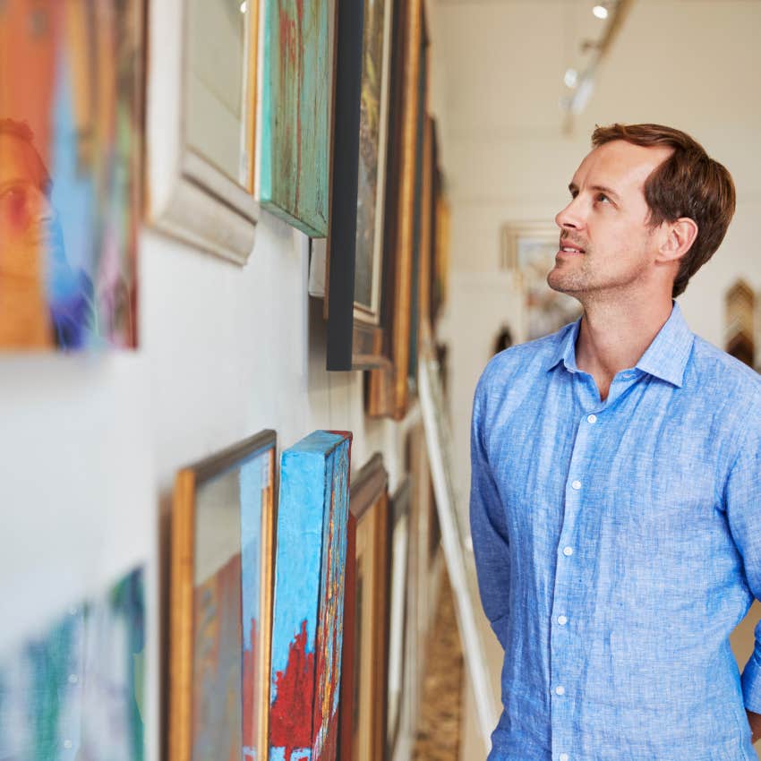 man with great taste looking at the art that means something in his home