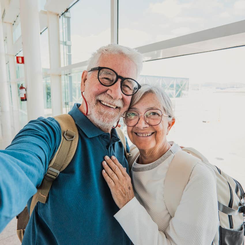 Compatible couple traveling together in an airport.