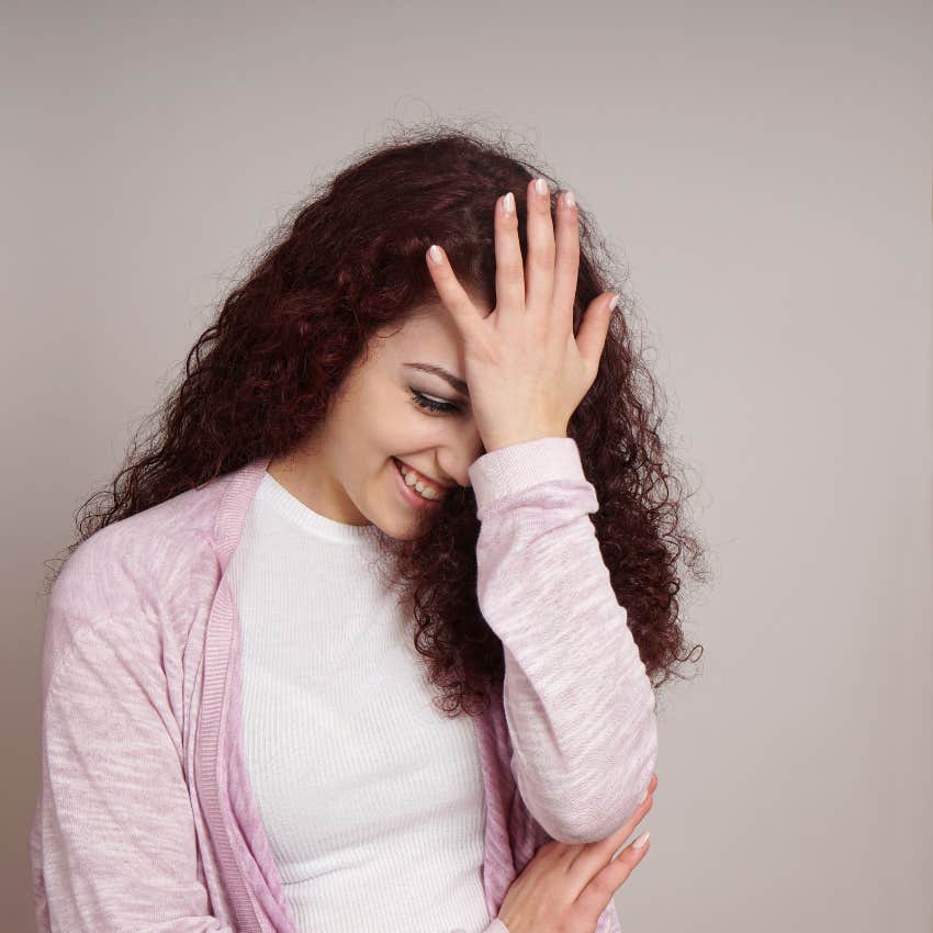 awkward woman feeling uncomfortable because someone else wanted her to feel that way