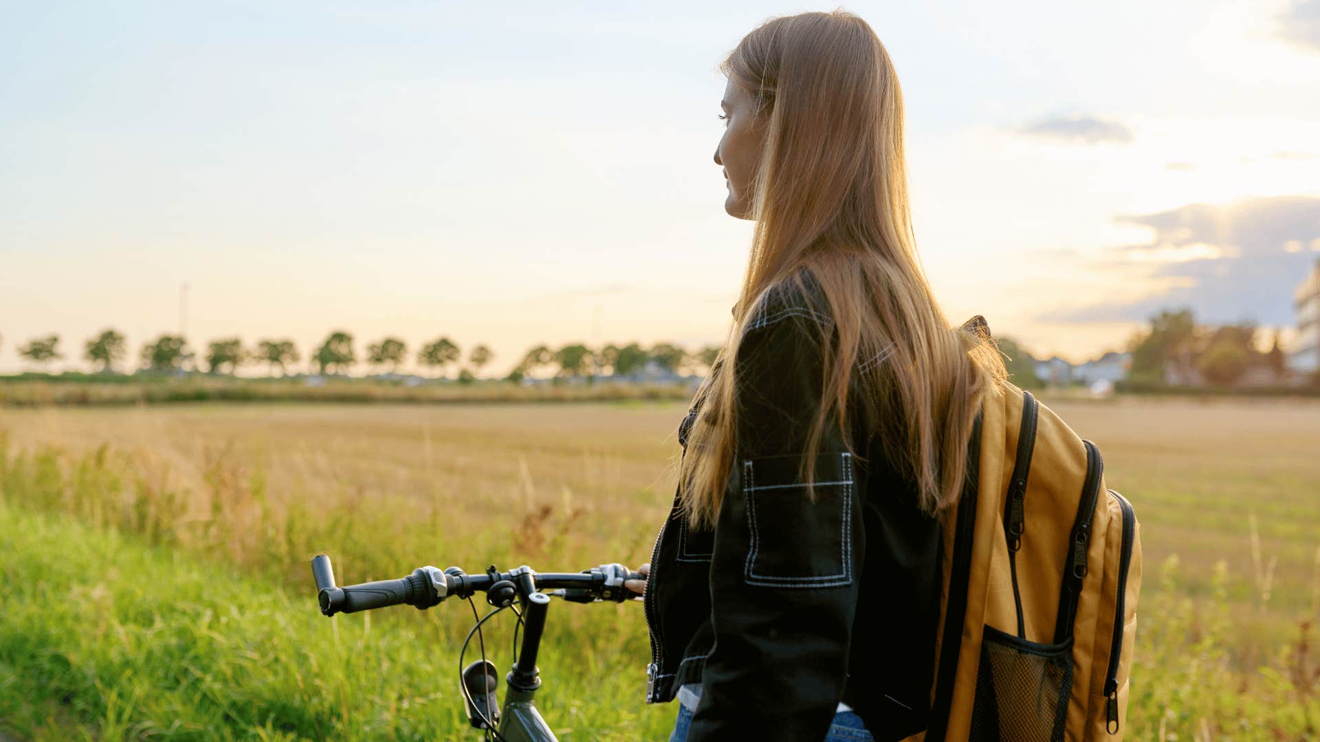 teenage girl biking to school alone 