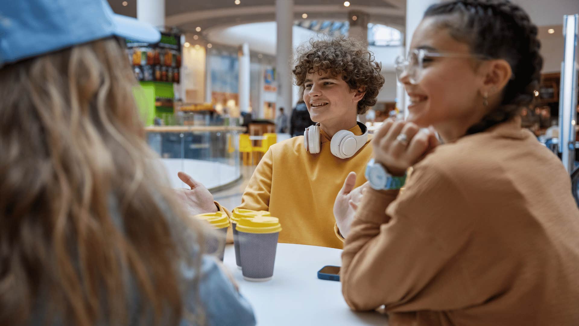 group of teens hanging out at the mall without parents