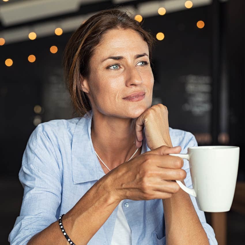 woman setting her own pace while drinking coffee and doing nothing