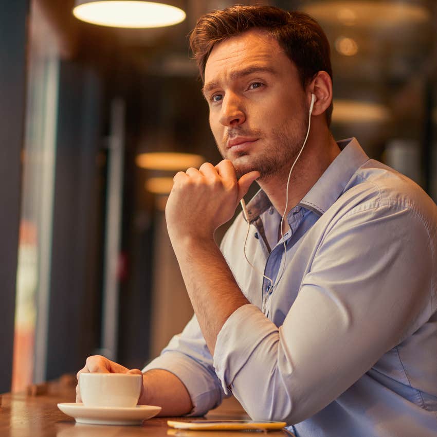 confident man drinking coffee and doing nothing