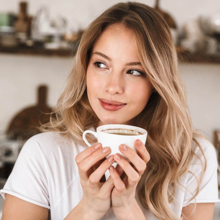 low-maintenance woman drinking coffee and doing nothing