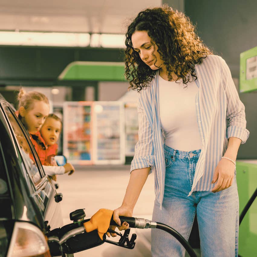 Gen X woman pumping gas