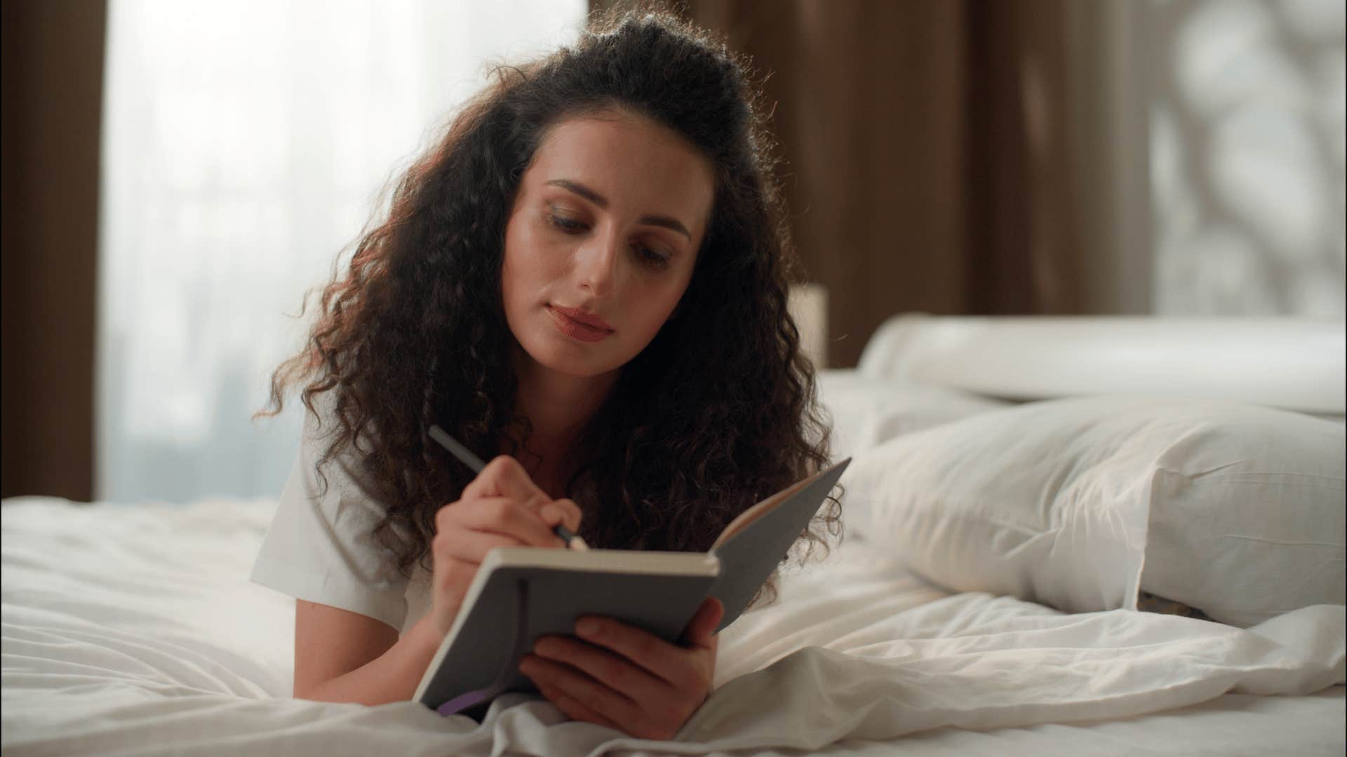 teen girl writing in her journal not having access to screens