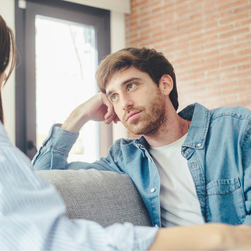 Man saying, "I didn't hear you" to his partner.