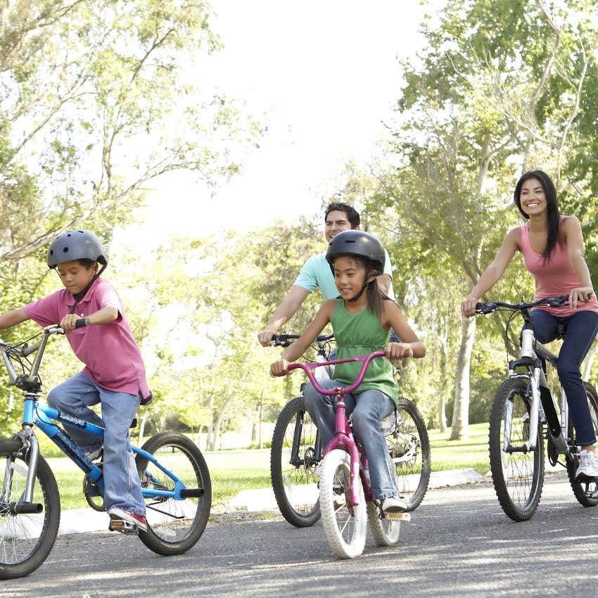 kids riding bikes with their parents
