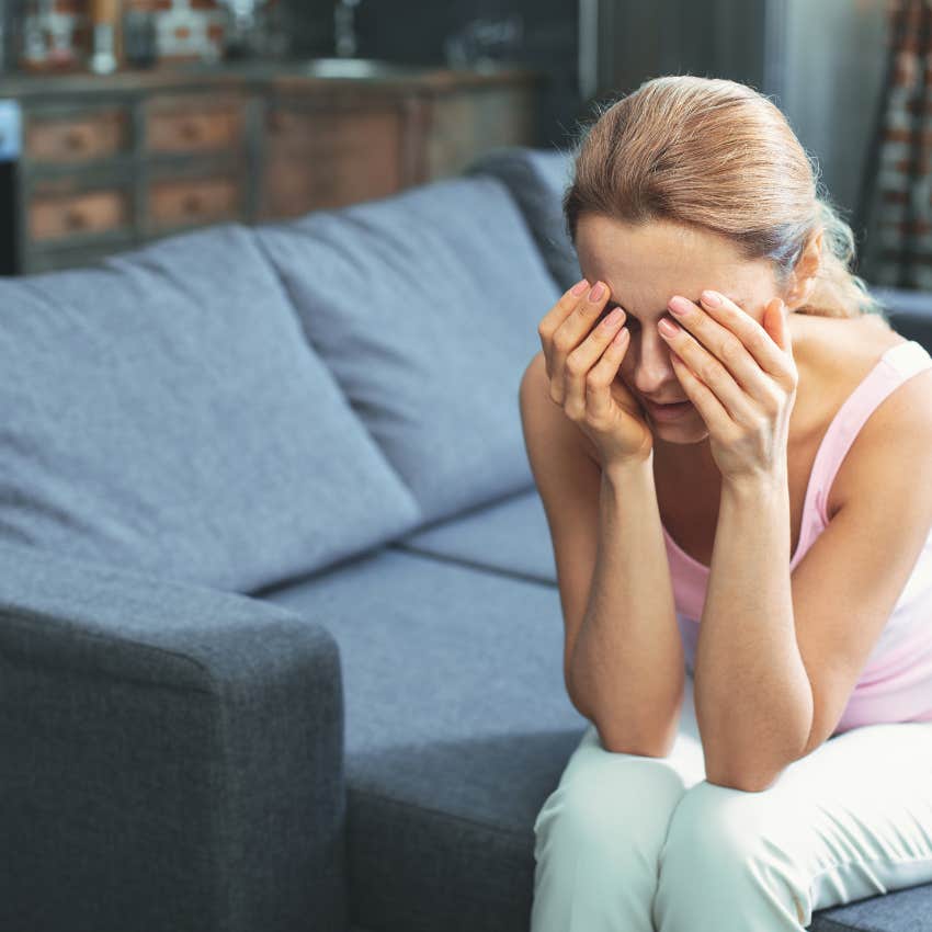 lonely woman sitting at home crying