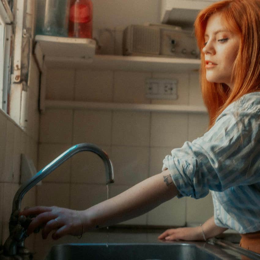 lonely wife doing the dishes by herself