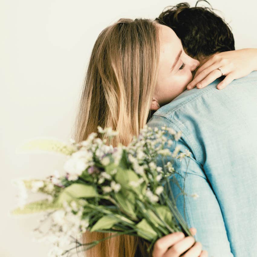 woman accepting flowers from chivalrous man