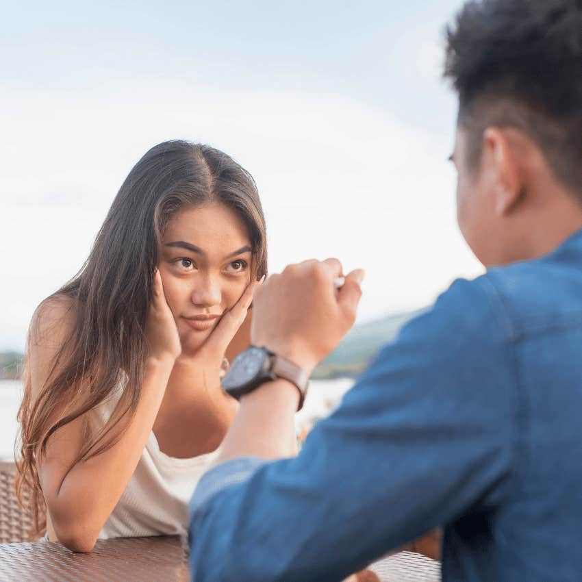 woman who's hard to read talking to man