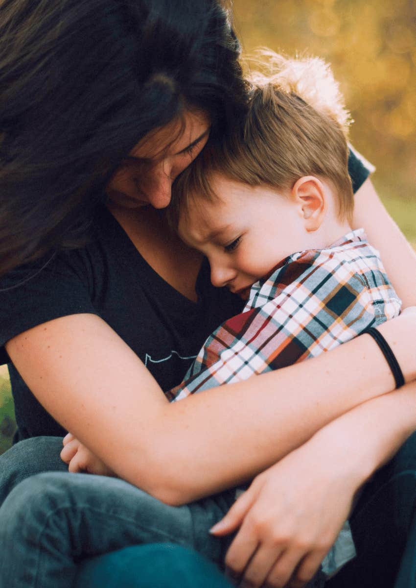 woman hugging young boy close in gentle parenting