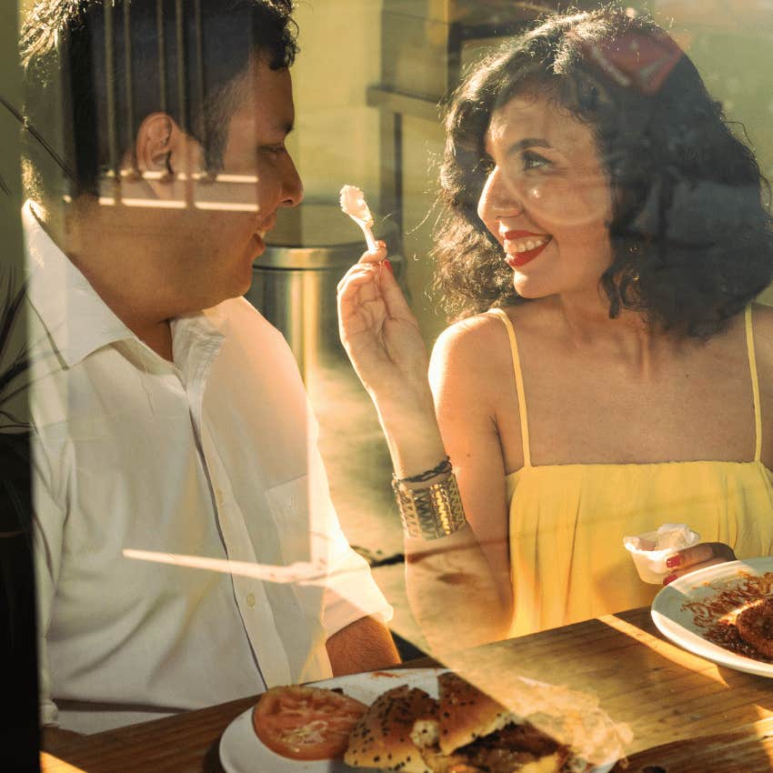 woman surprising man with lunch