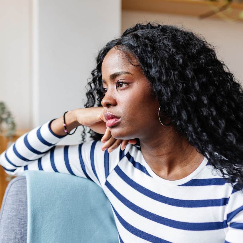 Woman grieving the potential of her relationship at home.