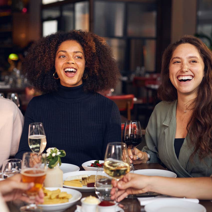 woman laughing at herself with friends