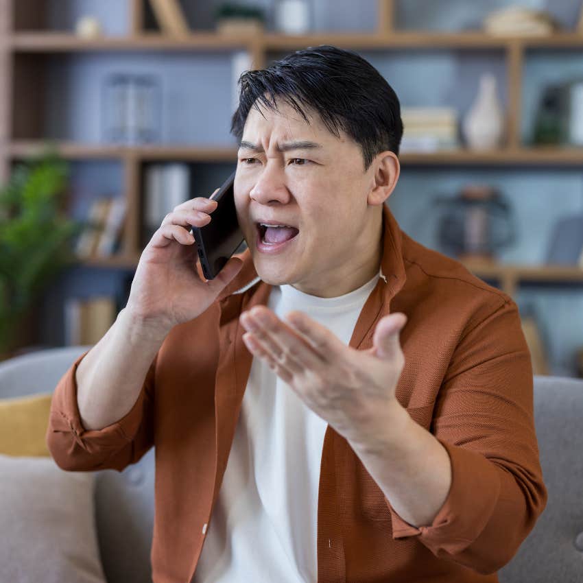 Man yelling at a service worker on his phone