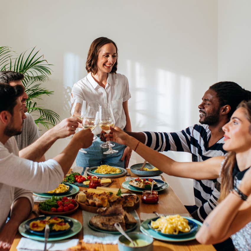 woman who invited party guests giving a toast