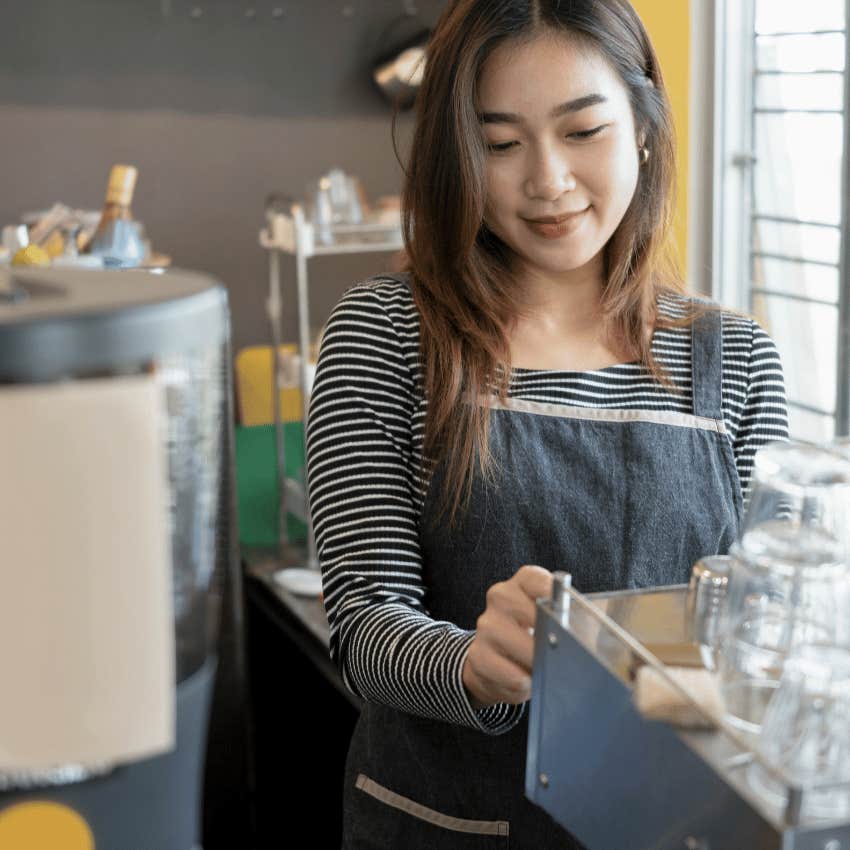 young woman employee at coffee shop