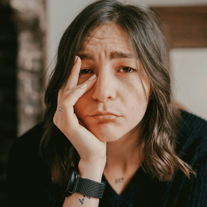 young woman with a nervous expression