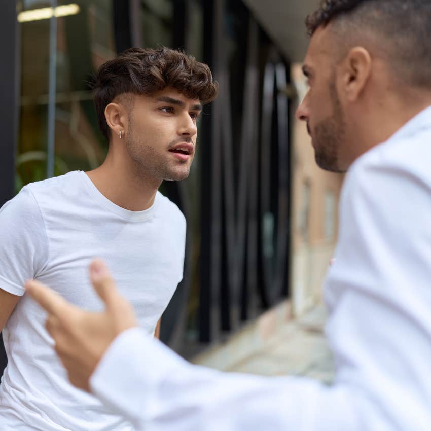 angry man getting defensive with friend after saying your decision