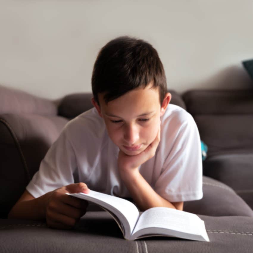 kid spending time alone reading