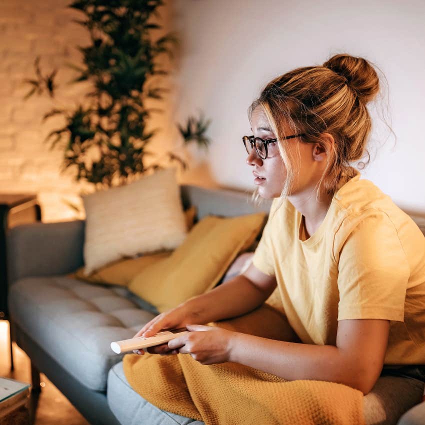person working from home and watching tv
