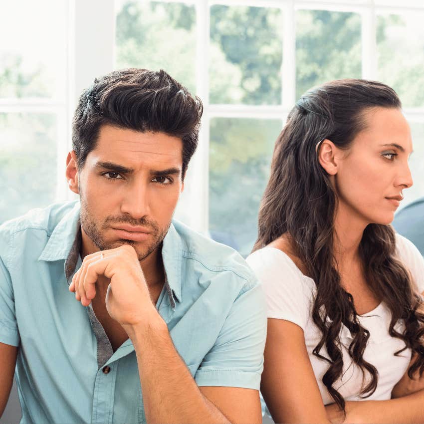 annoyed woman looking away from dishonest man
