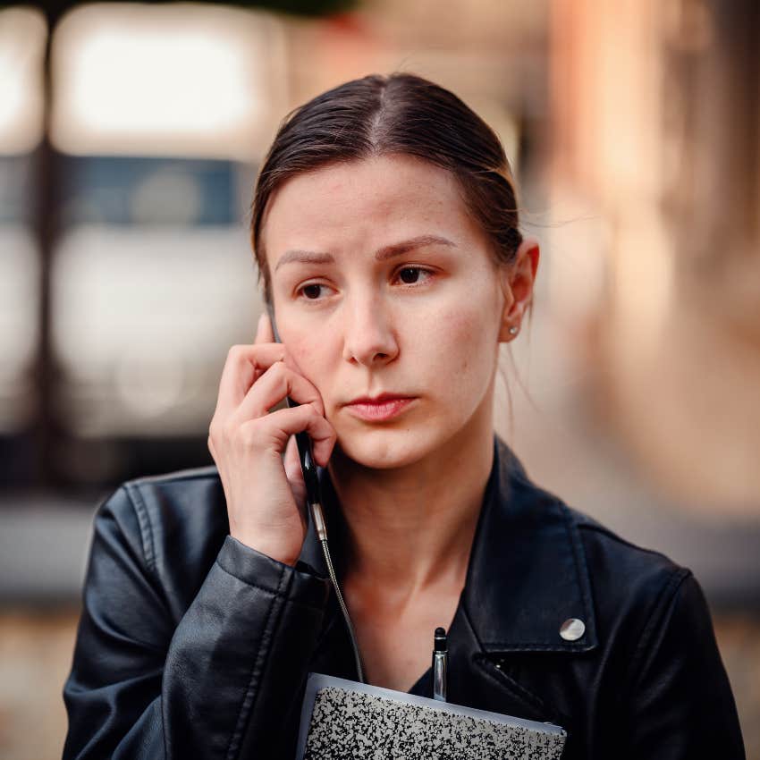 woman whose parents lacked empathy apologizing to someone on the phone