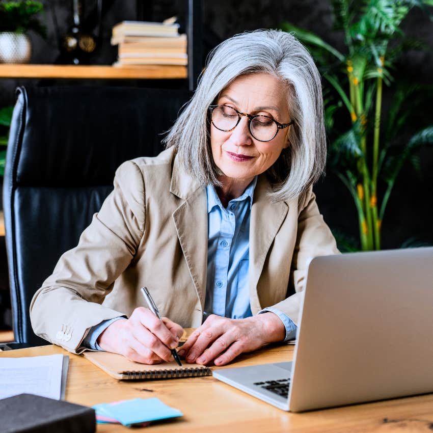 Adaptable boomer woman thinking at work.