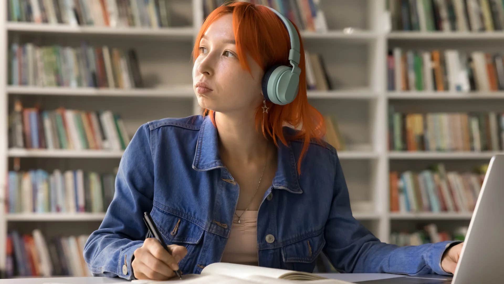 gen Z woman thinking critically at the library