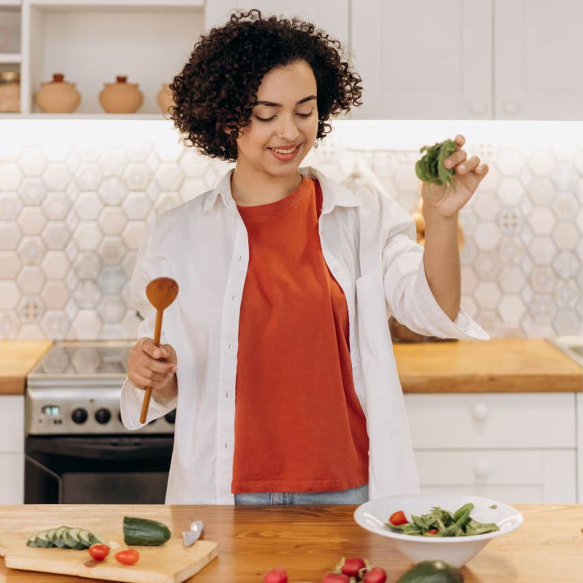 young adult trying to cook a simple meal at home