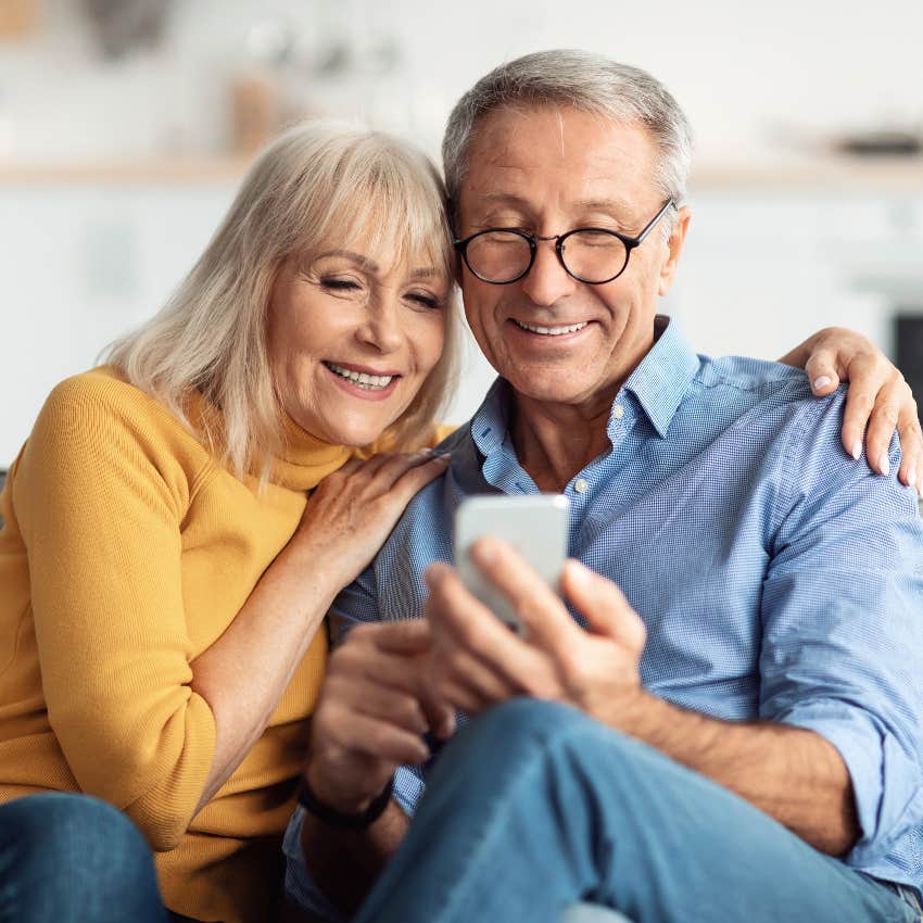 older couple reading text from their adult child who set boundary to keep conversations digital