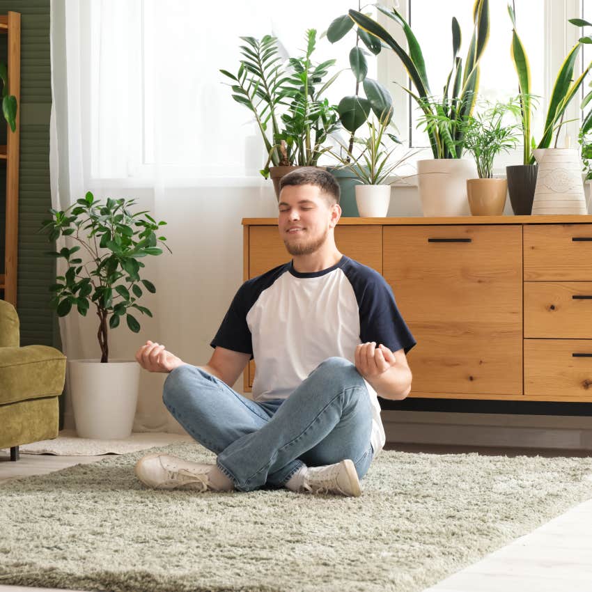 man bringing plants into his home after going through a difficult time
