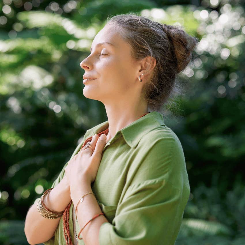 calm woman embracing her spiritual power
